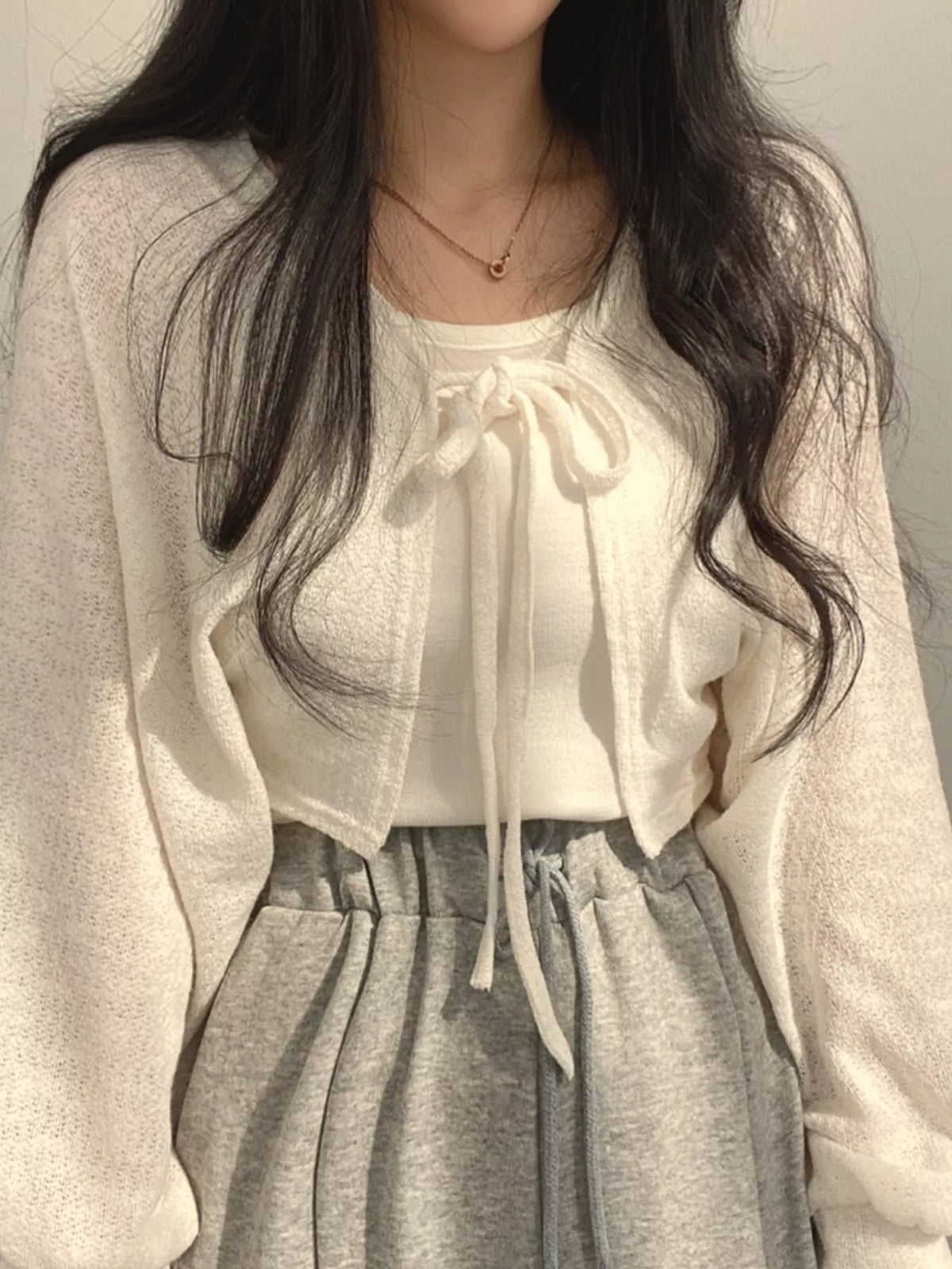 Round neck long sleeve cardigan, front view on model