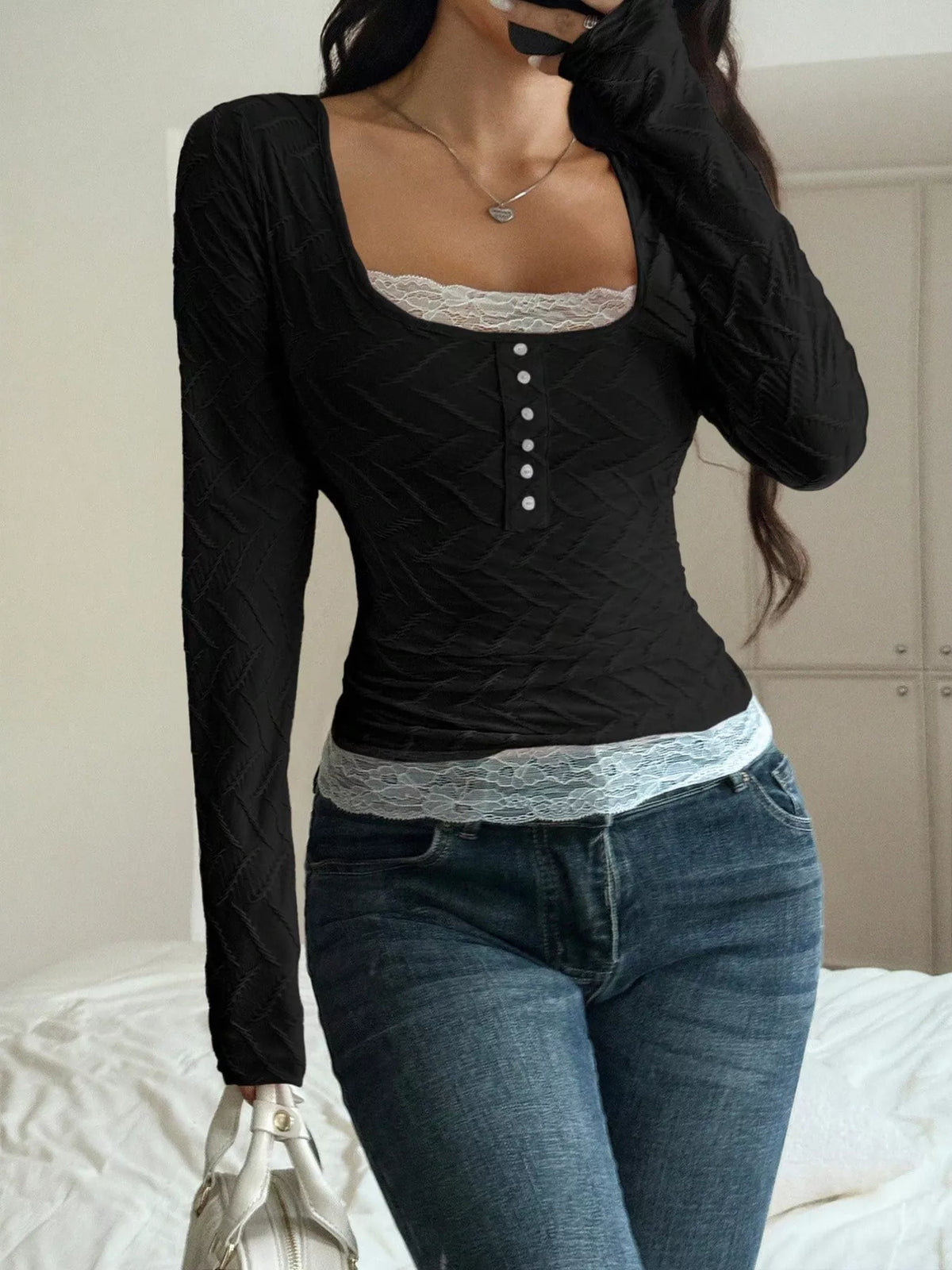 Black square-neck lace-trim top, front view with bag
