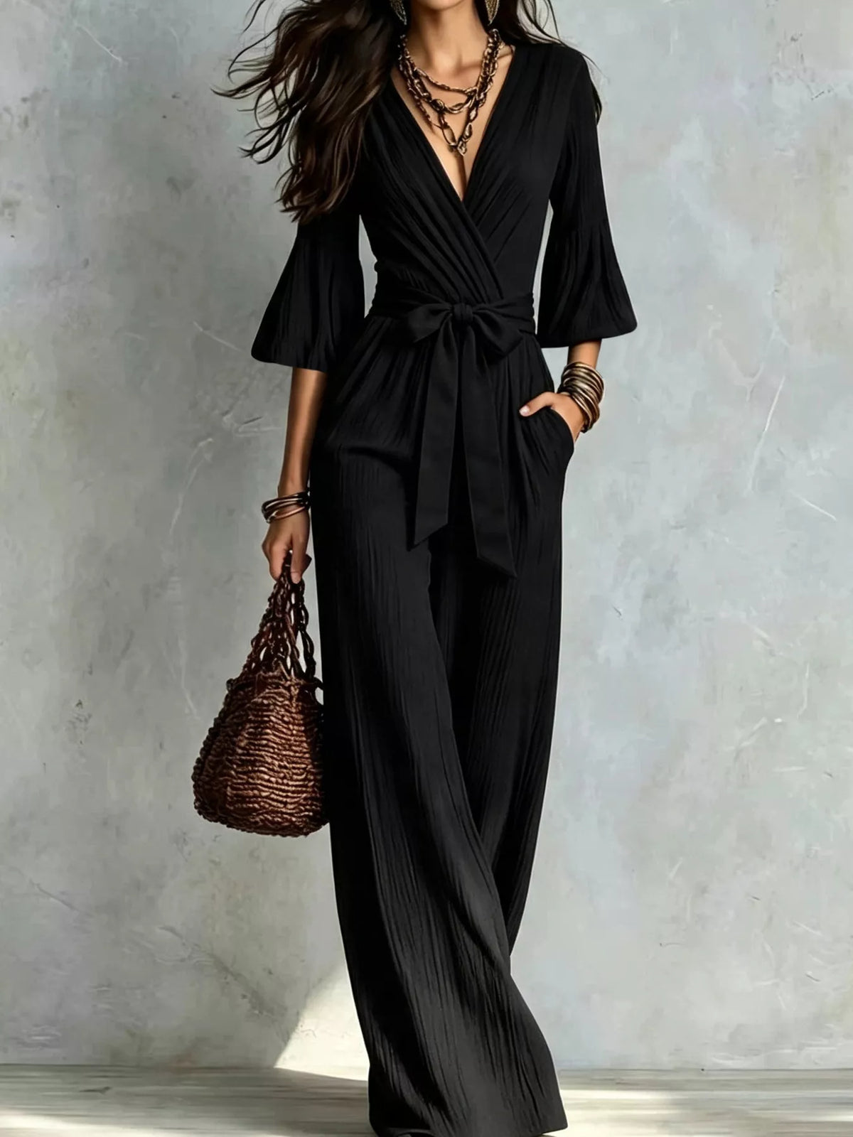 Black pleated wide-leg jumpsuit with tie-waist