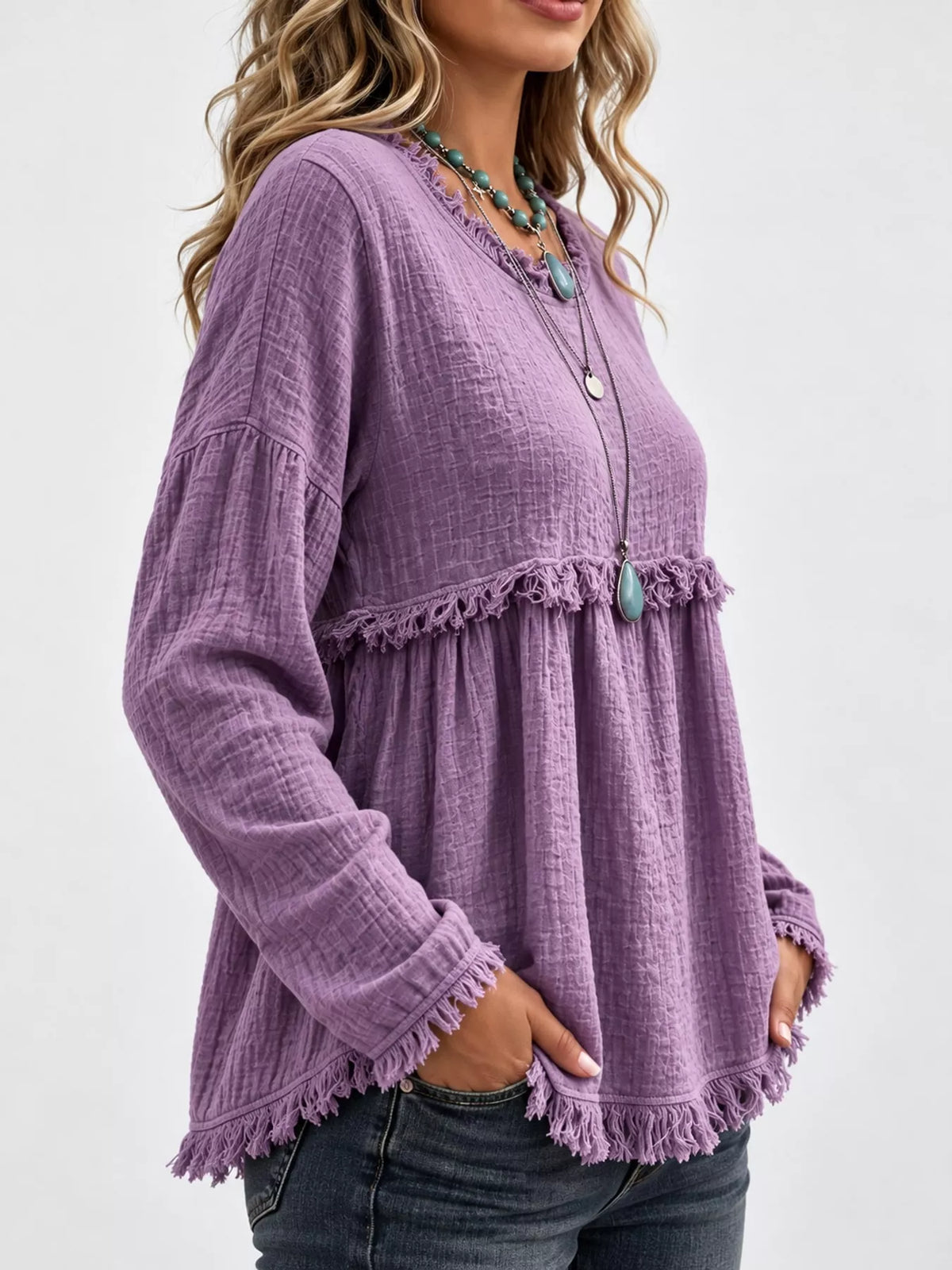 Purple frayed hem textured blouse, side view