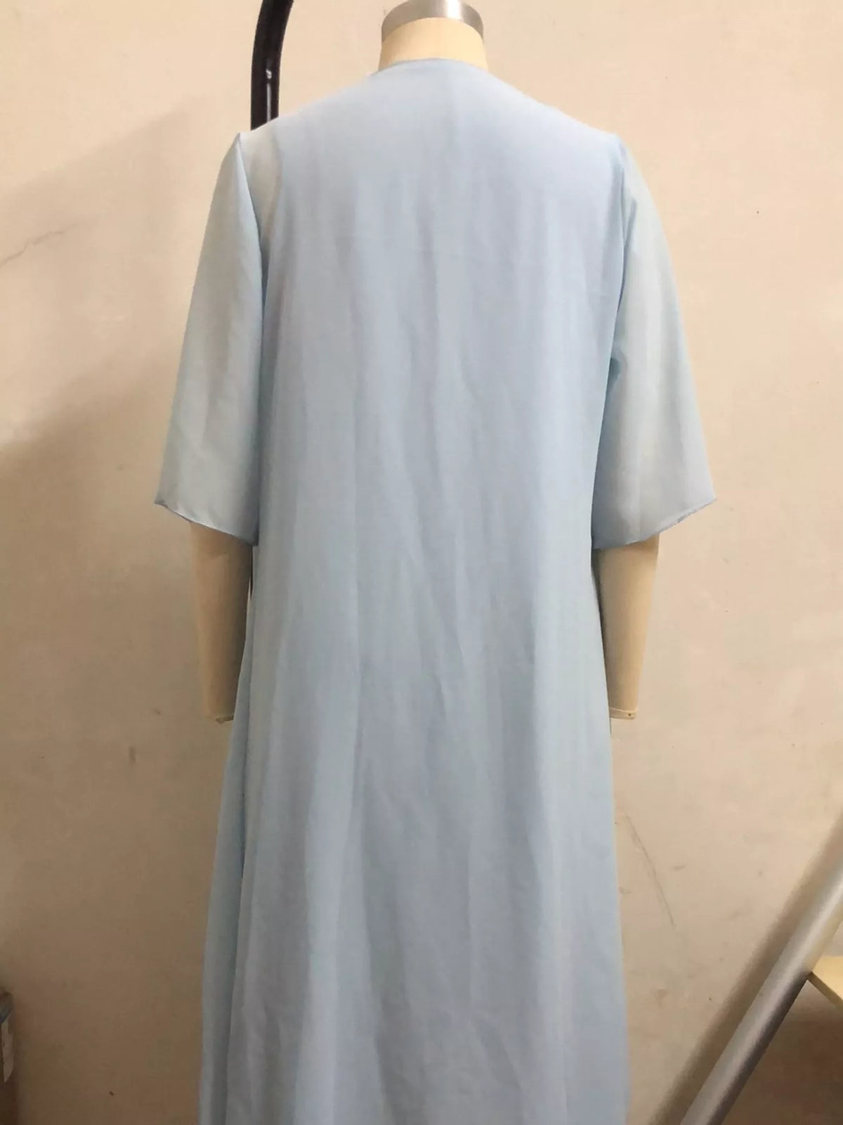 Blue lace overlay dress and chiffon cardigan set, back view