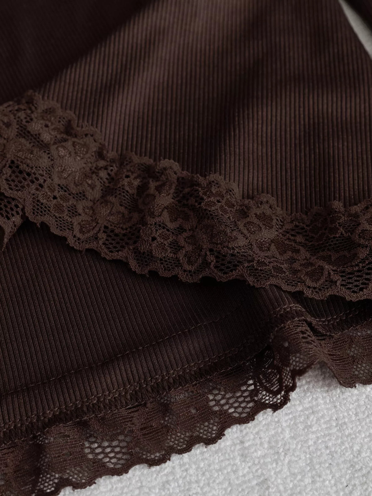 Women's Lace Trim Flare Sleeve Blouse in brown — hem detail view