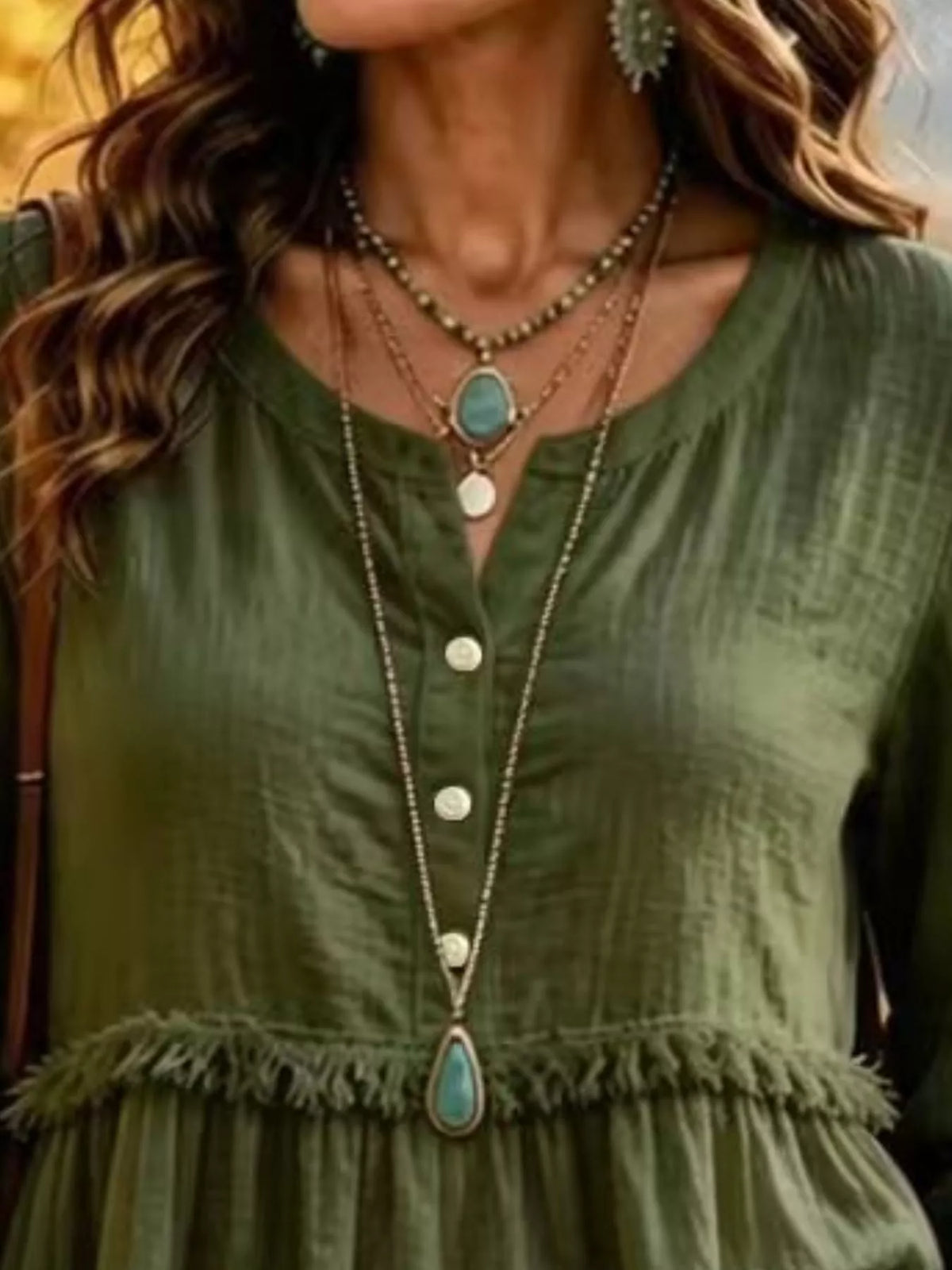 Green fringed button detail blouse, split neckline, front buttons, and frayed waist seam