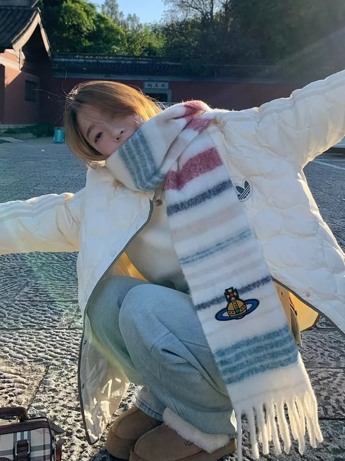 Embroidered Orb Logo Plaid Scarf, shown worn