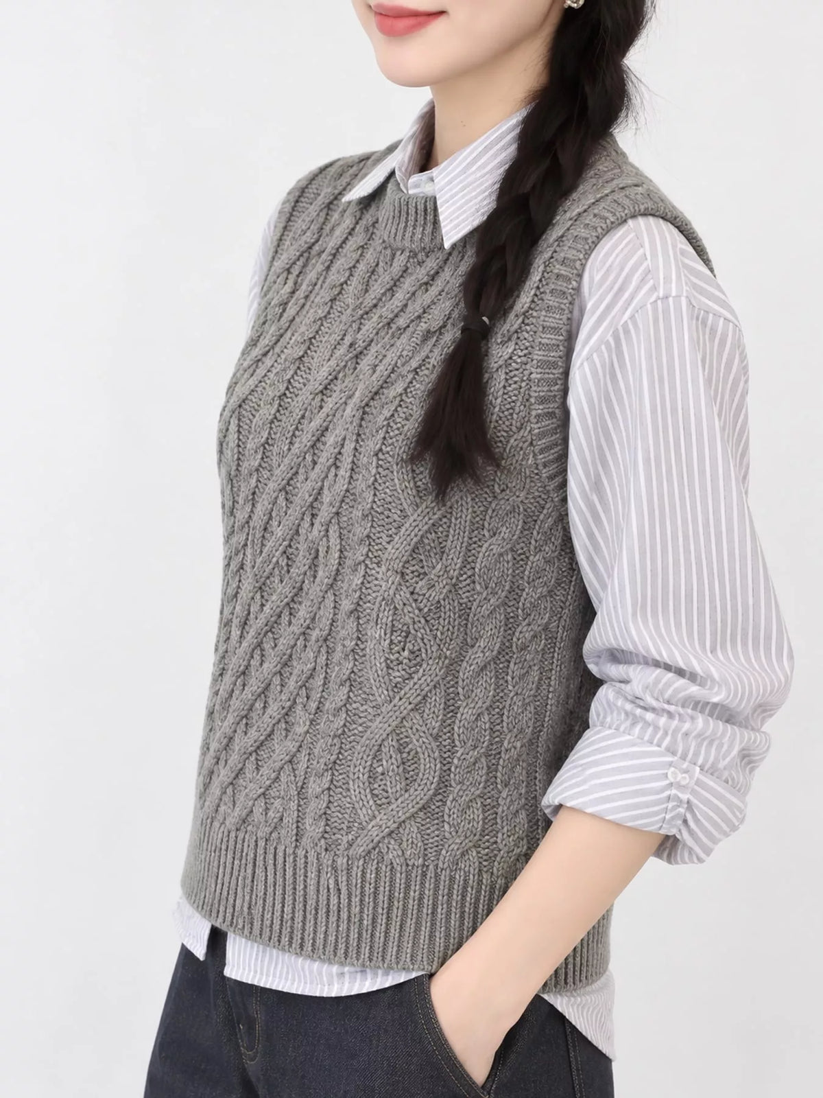 Gray cable-knit sweater vest, side view