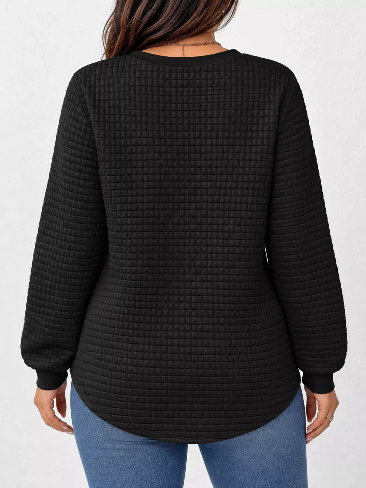Black waffle knit sweatshirt with curved hem, back view