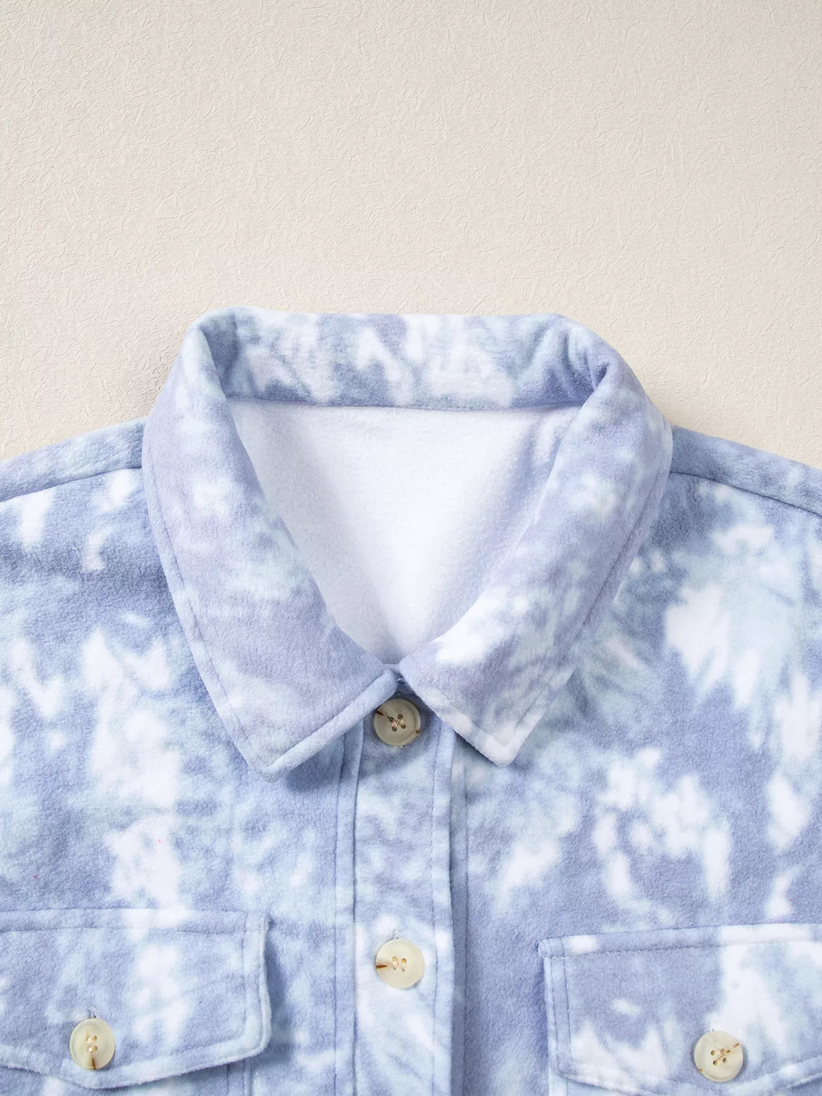Collar and chest pocket on light blue abstract print fuzzy collar tunic jacket