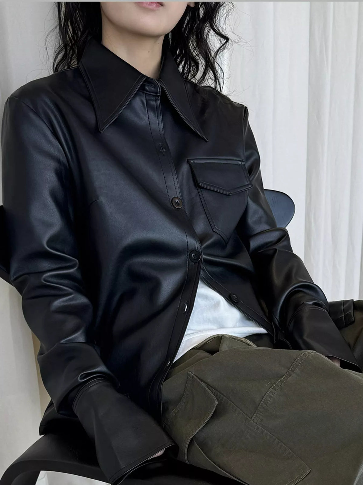 Black faux leather button-front jacket — front view