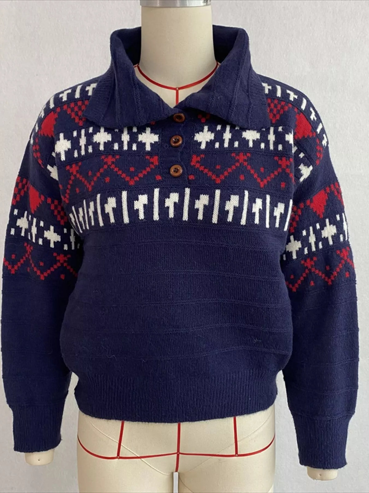 Navy fair isle polo-collar sweater, front on dress form.