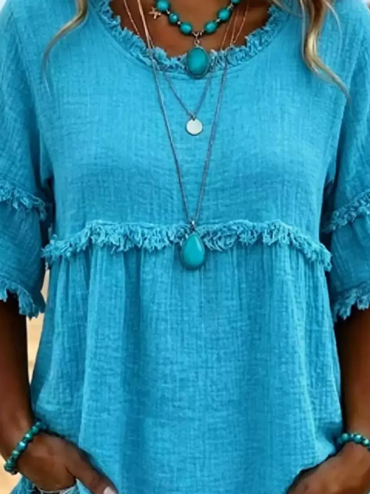 Turquoise frayed edge textured blouse, frayed neckline and gathered upper panel