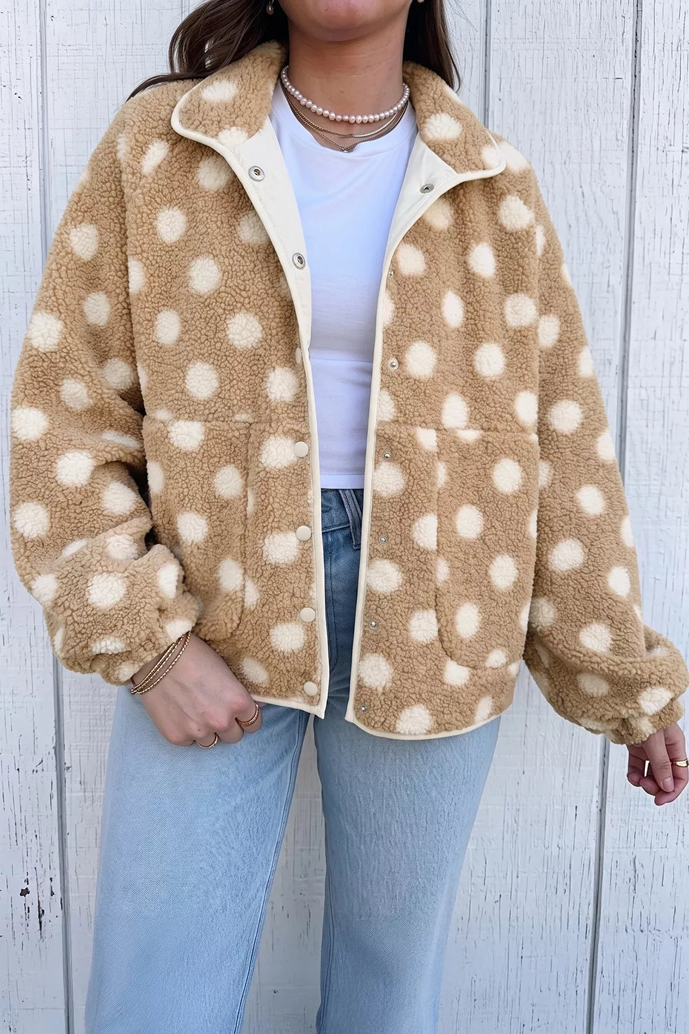 Tan and white polka dot faux fur button-front jacket with zip pockets
