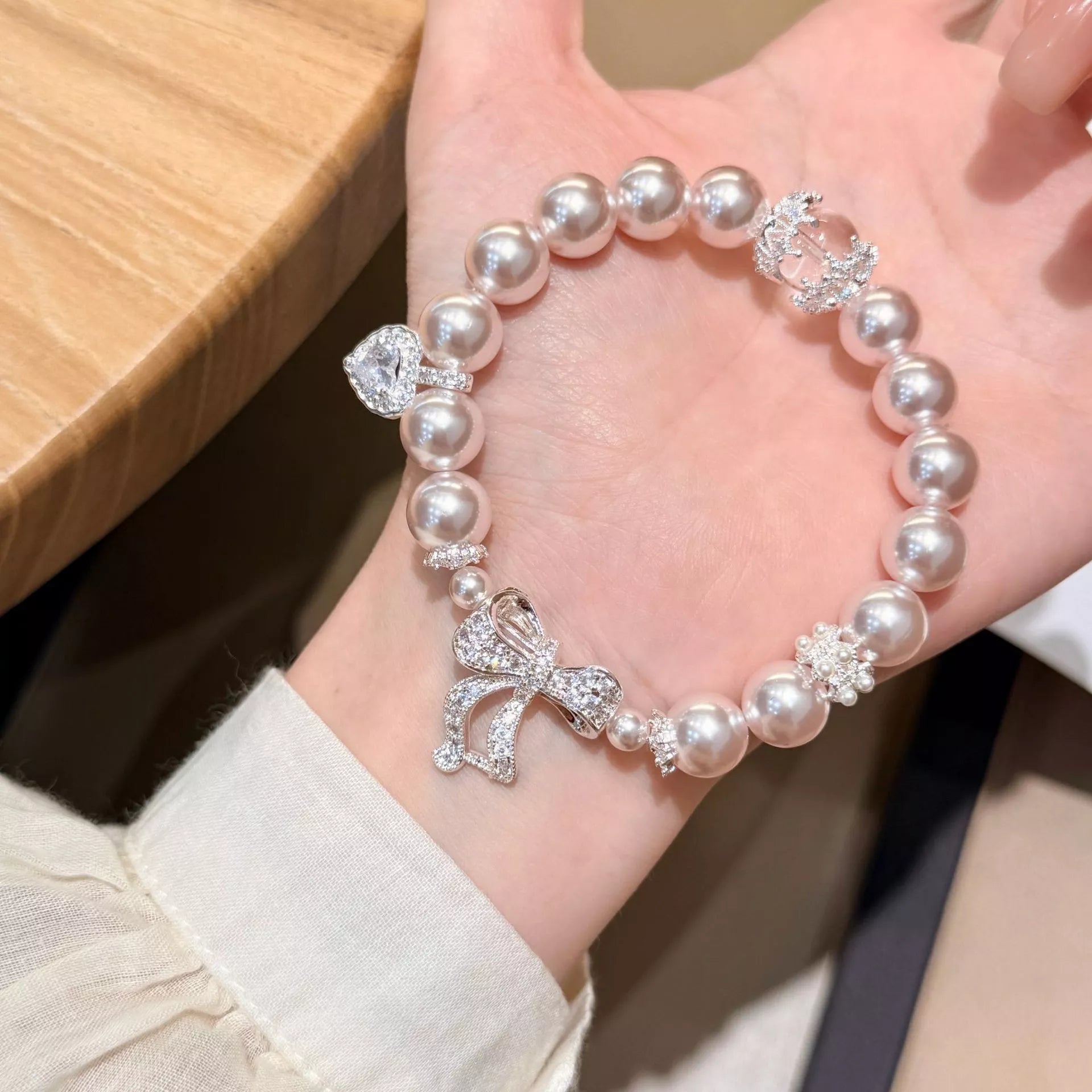 Trendsi Pearl Bracelet with Bow Charm -