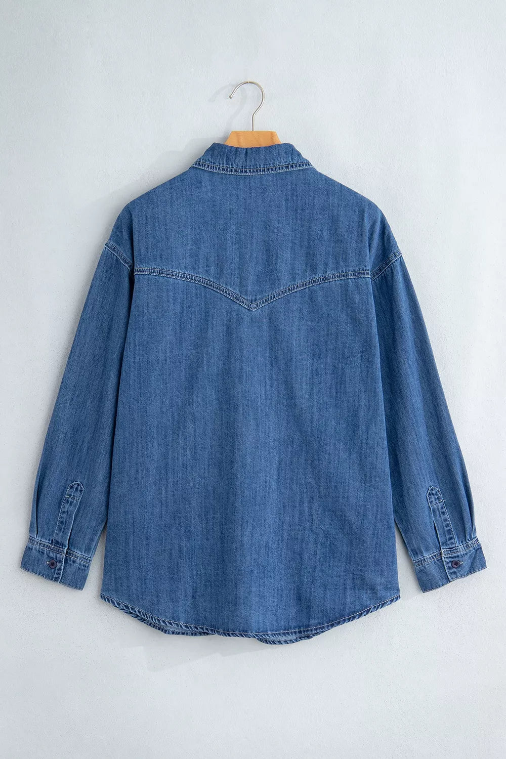 Blue western pocket denim tunic shirt, back on hanger