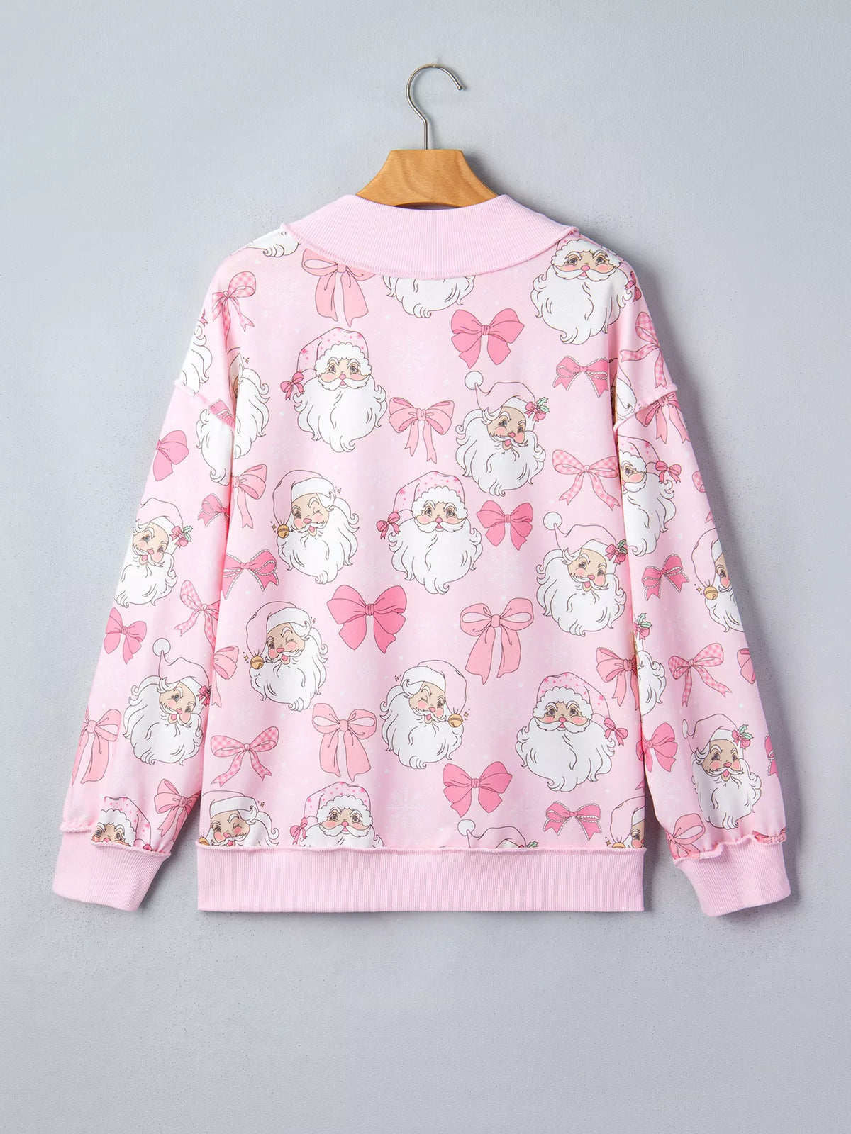 Santa-and-bow sweatshirt, pink hanging back