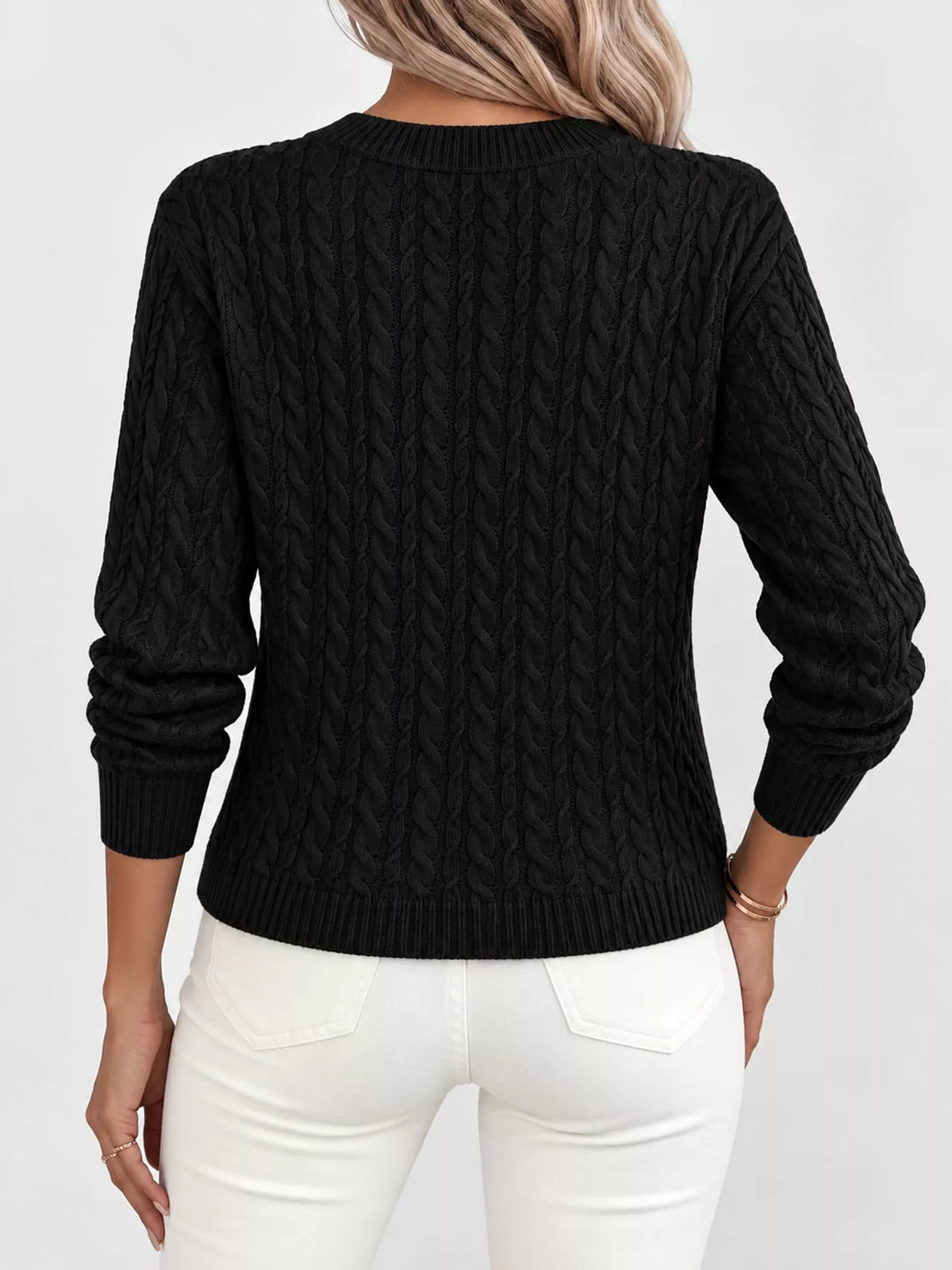 Black cable knit round neck sweater, back view