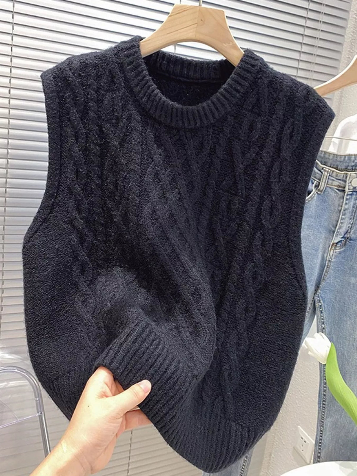 Black cable-knit sweater vest