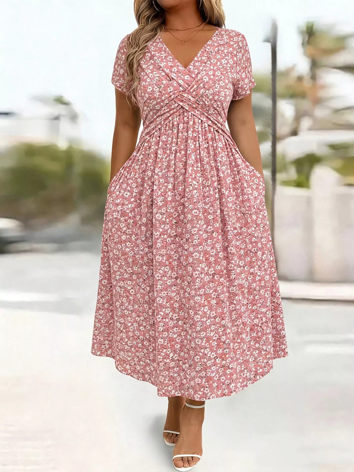 Pink floral short sleeve midi dress with pockets, front view