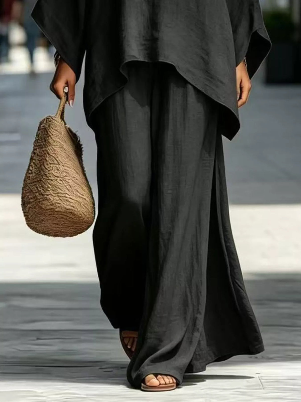 Black matching wide-leg pants and top hem detail