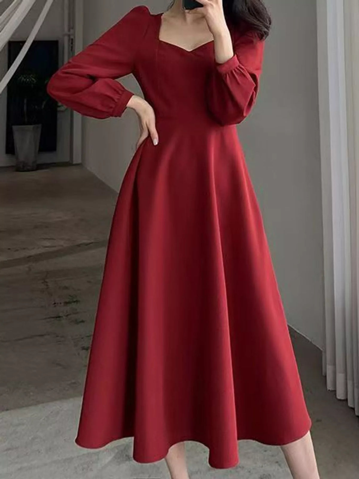 Burgundy long sleeve a line midi dress, front view