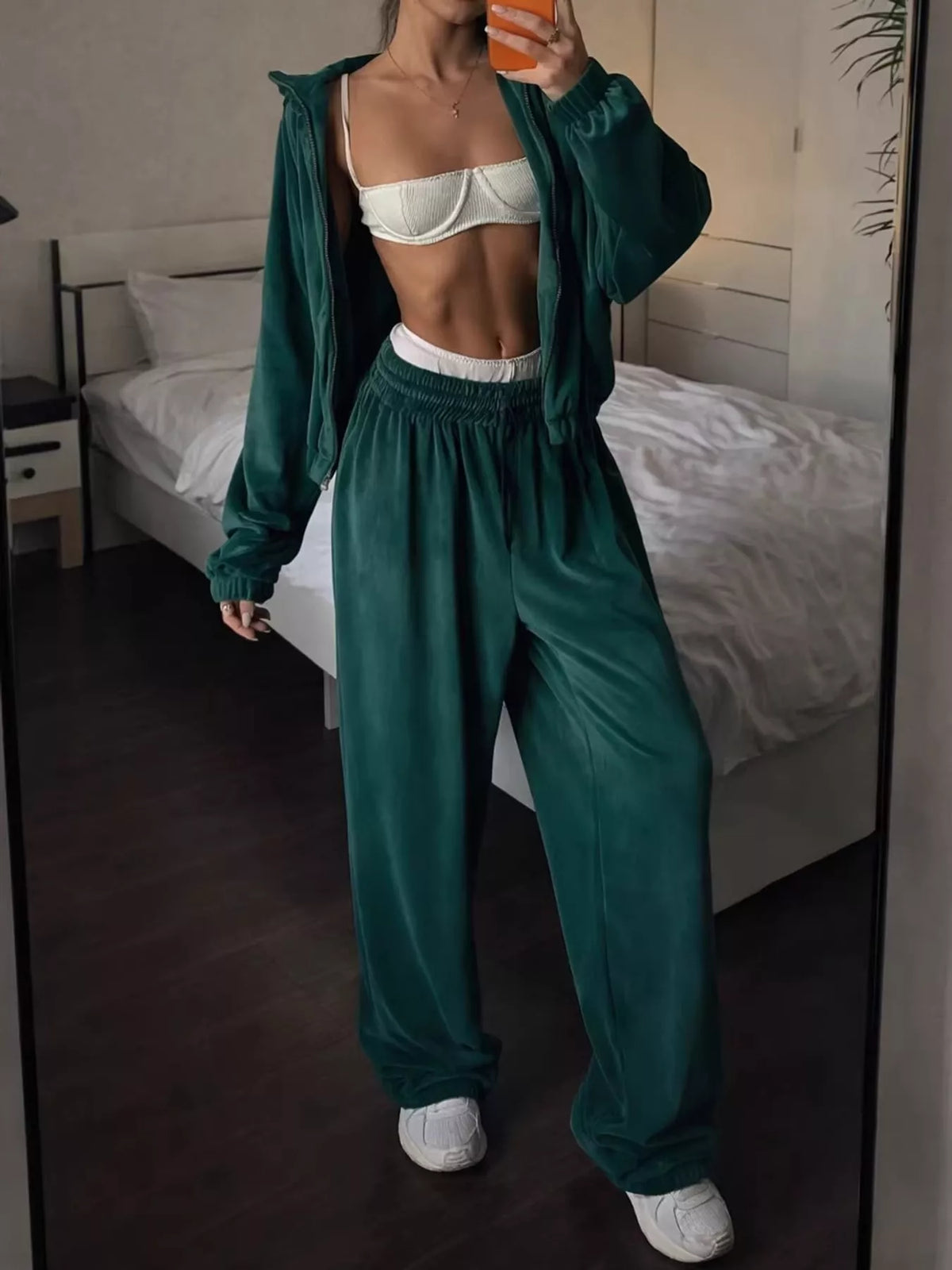 Green zip-up outerwear and pants set — front view