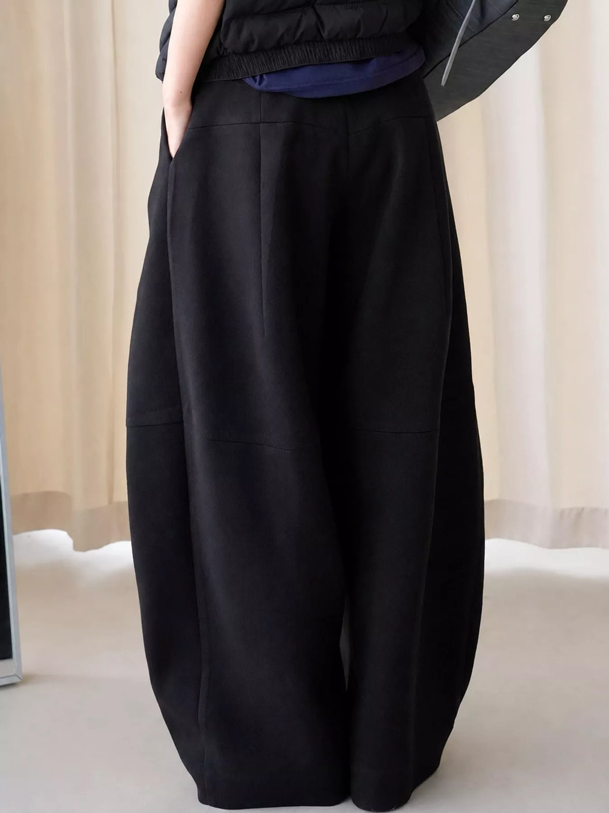 Pleated Wide-Leg Pants in black, front view