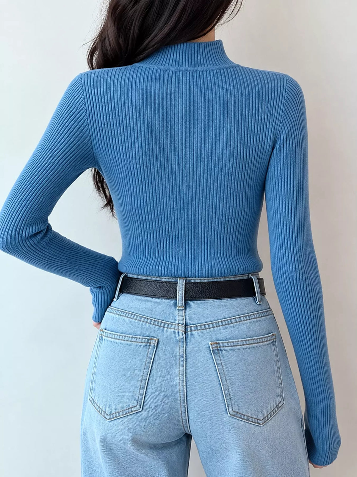 Blue ribbed mock neck long sleeve knit top, back view