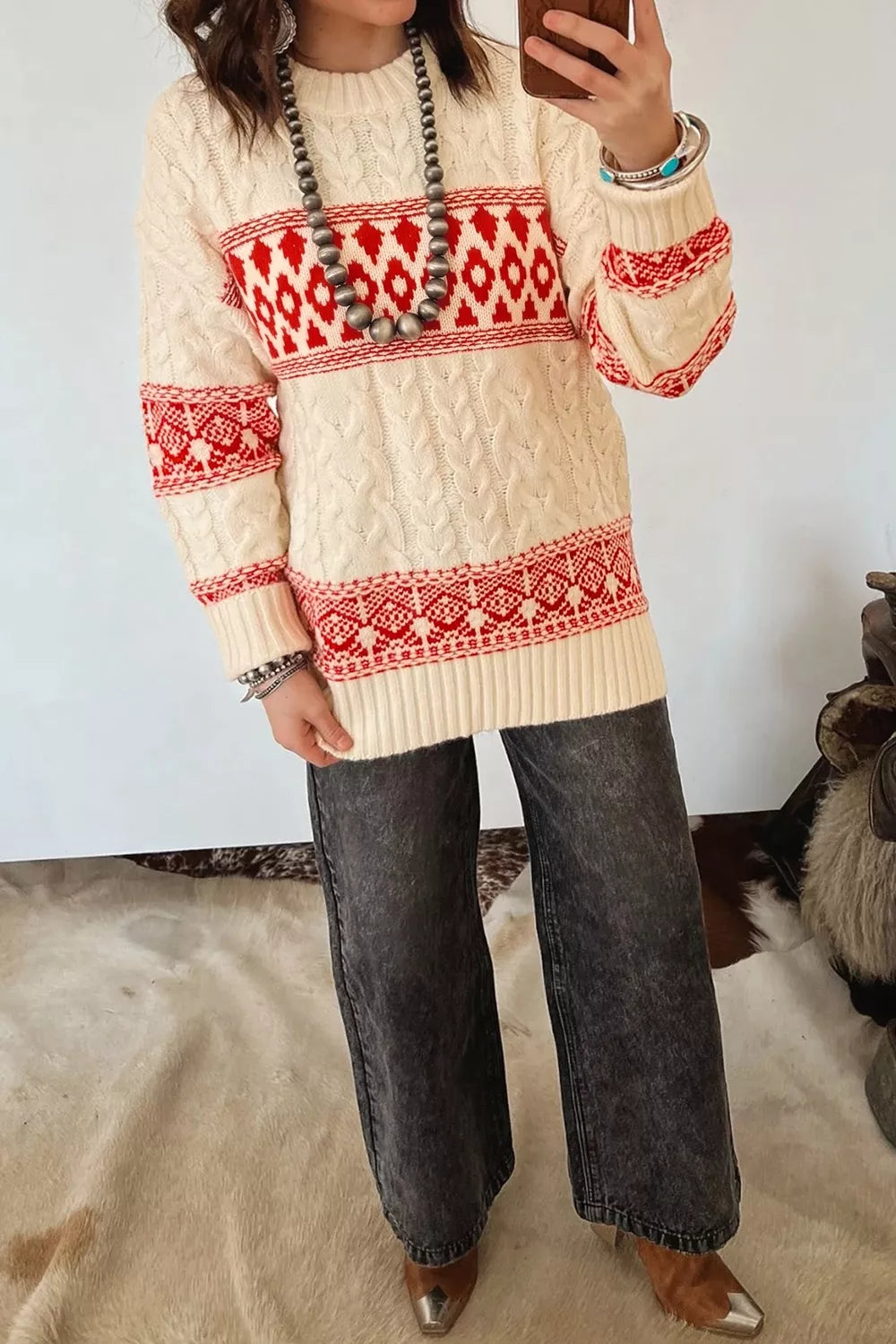 Ivory geometric cable-knit crewneck sweater, full front view.