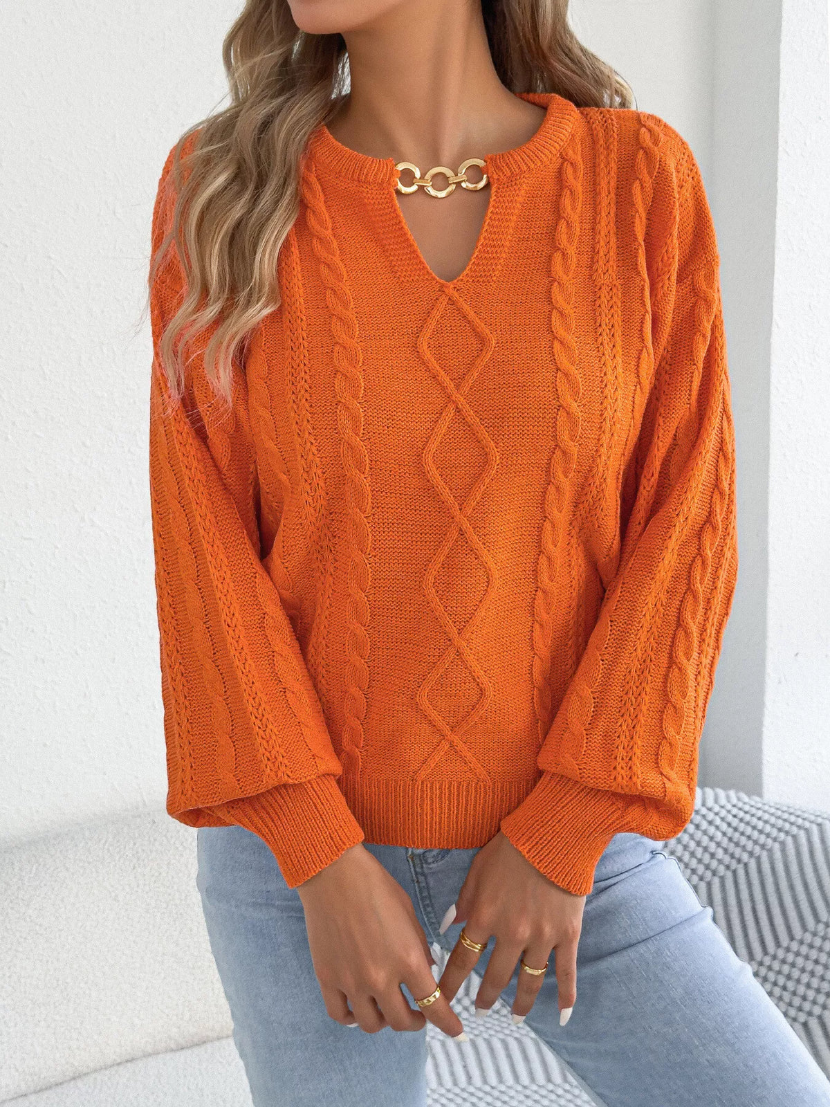 Orange cable knit notched sweater