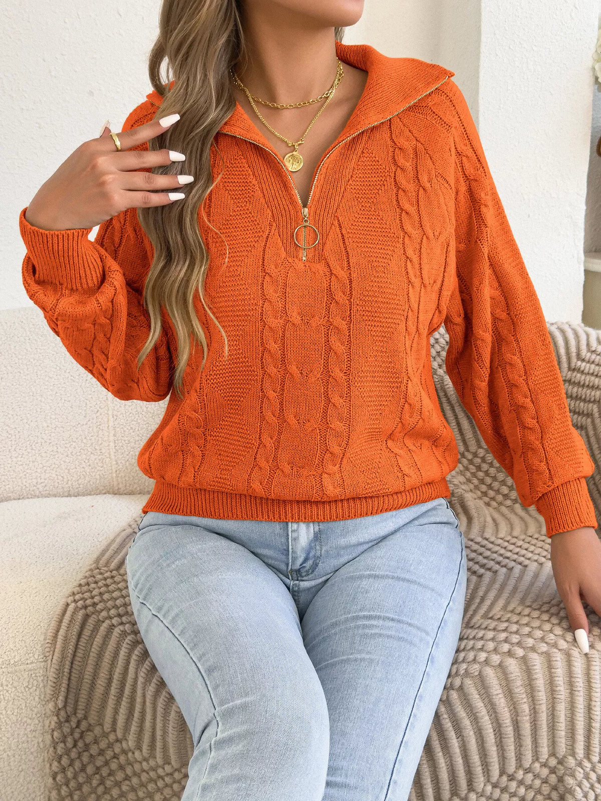 Orange quarter-zip cable knit sweater