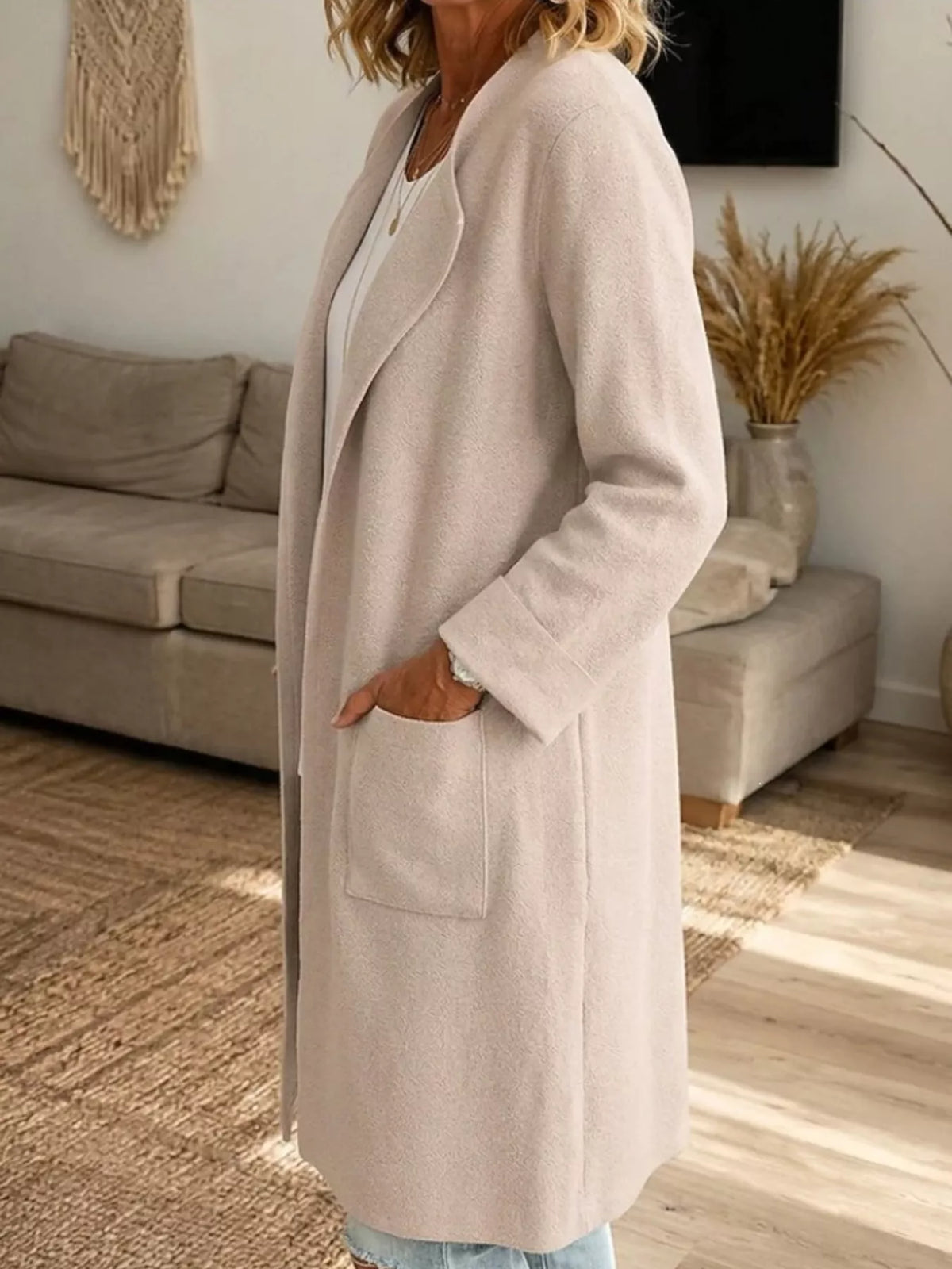 Beige open-front longline knit cardigan, side view