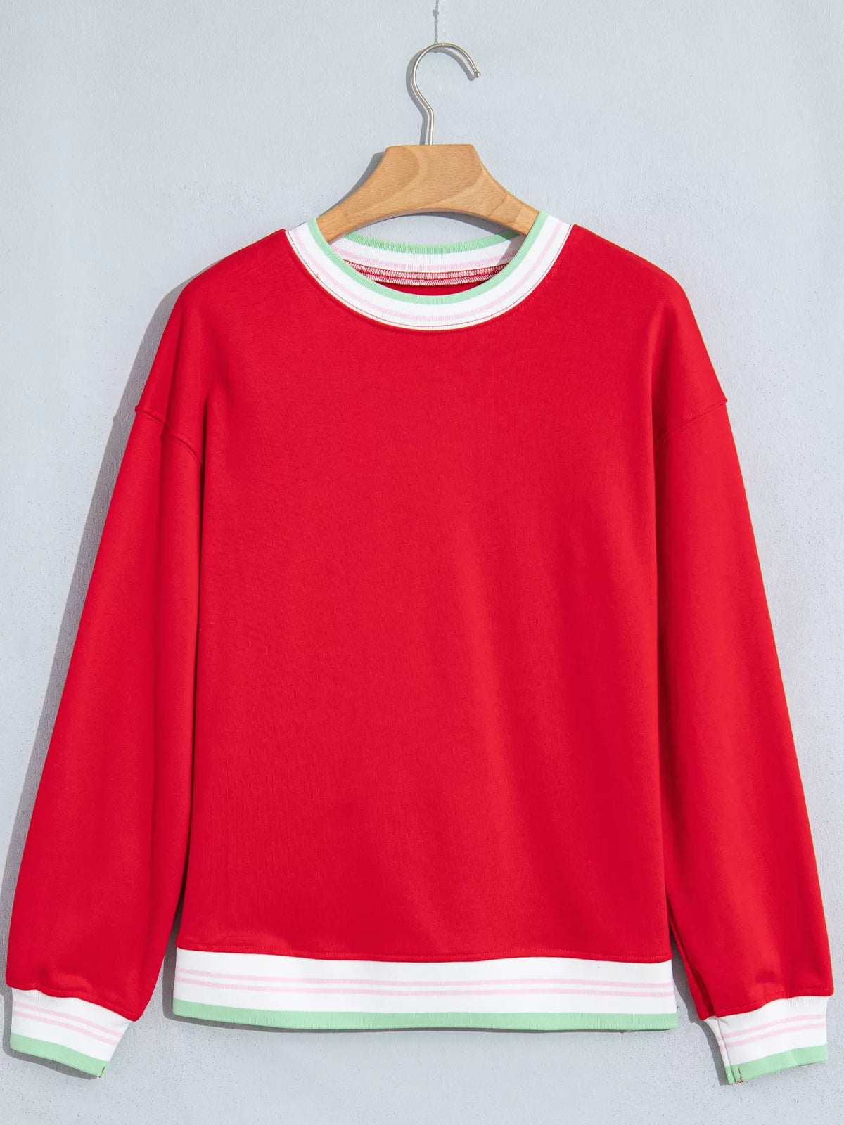 Red sweatshirt with contrast striped ribbed trim, front view