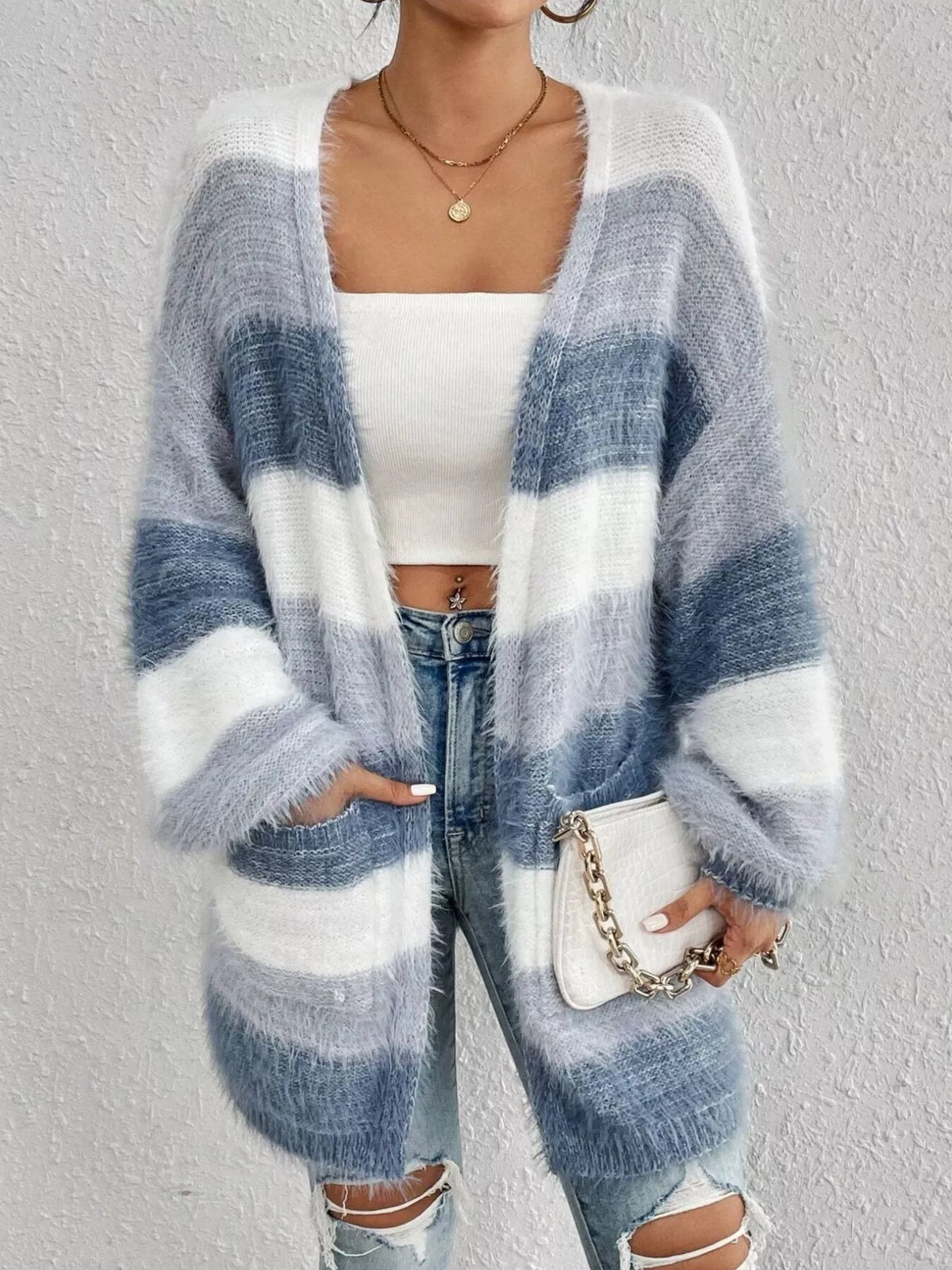Blue and white striped open-front oversized cardigan, full front view.