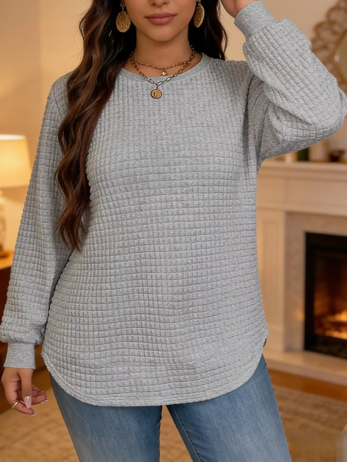 Gray waffle knit sweatshirt with curved hem