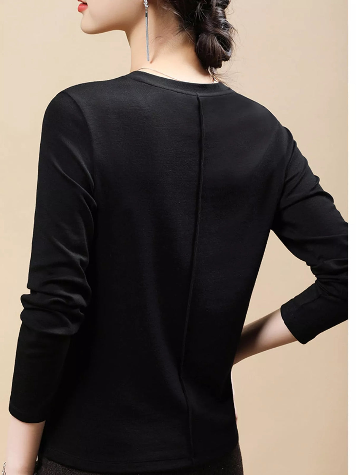 Black solid long-sleeve crew neck t-shirt, back view