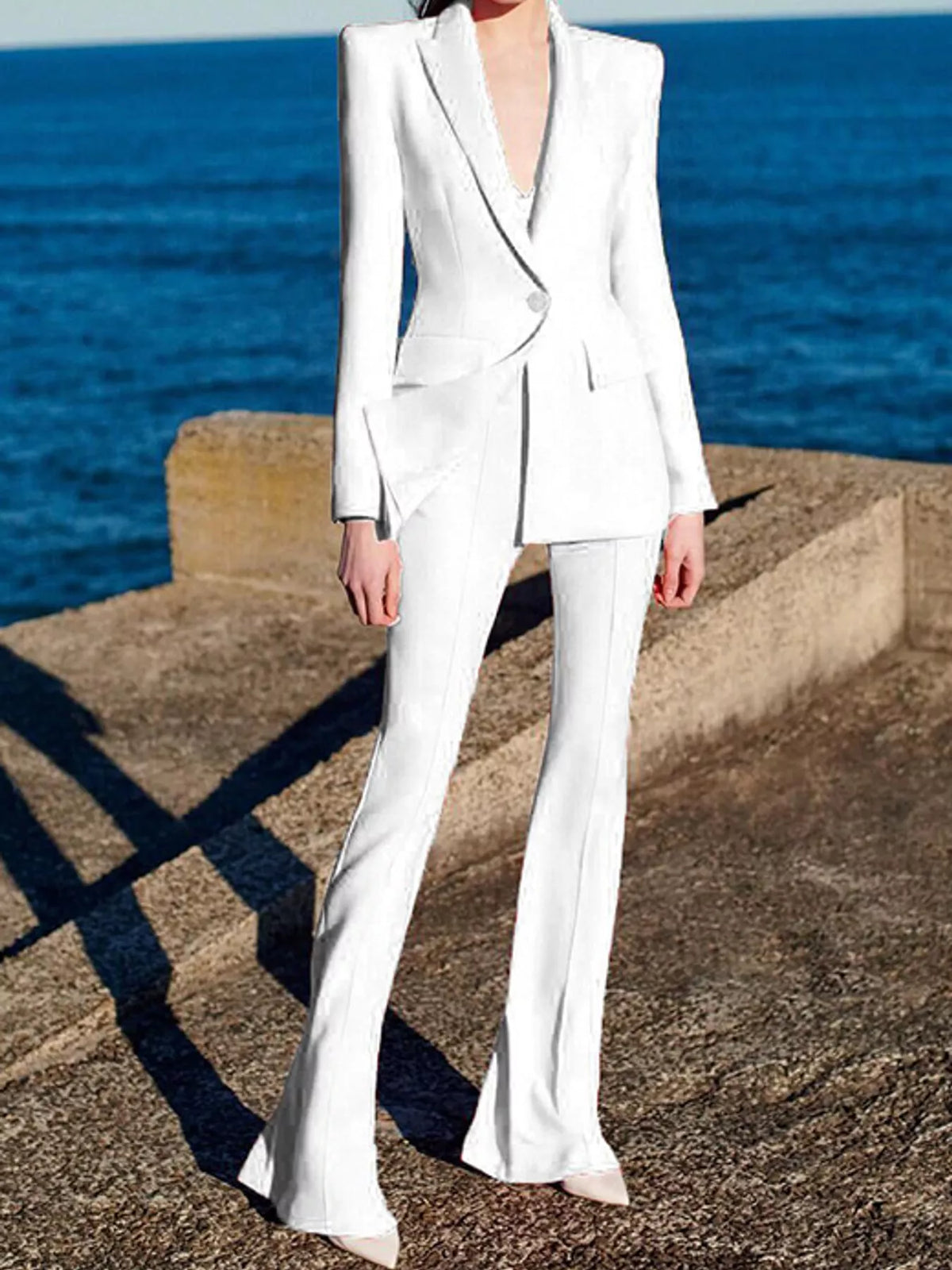 White one-button blazer and flared pants set
