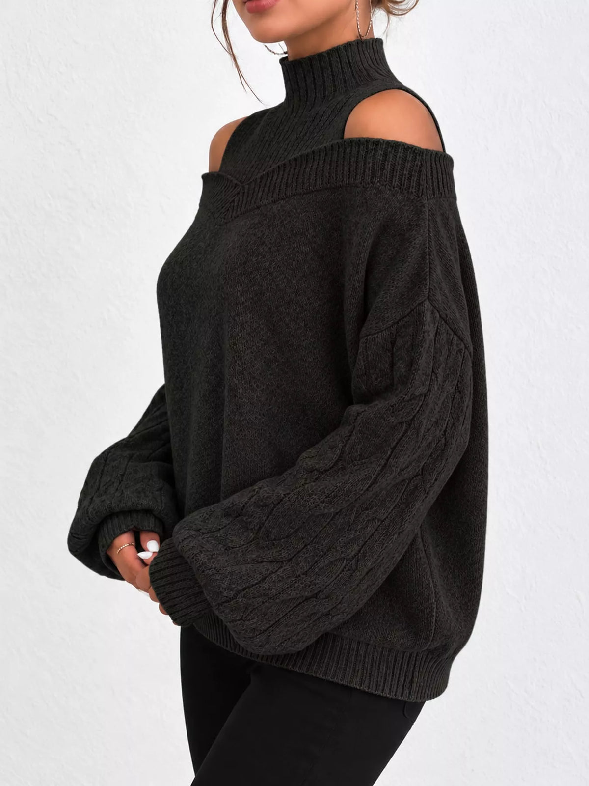 Black cold shoulder mock neck cable knit sweater, side view
