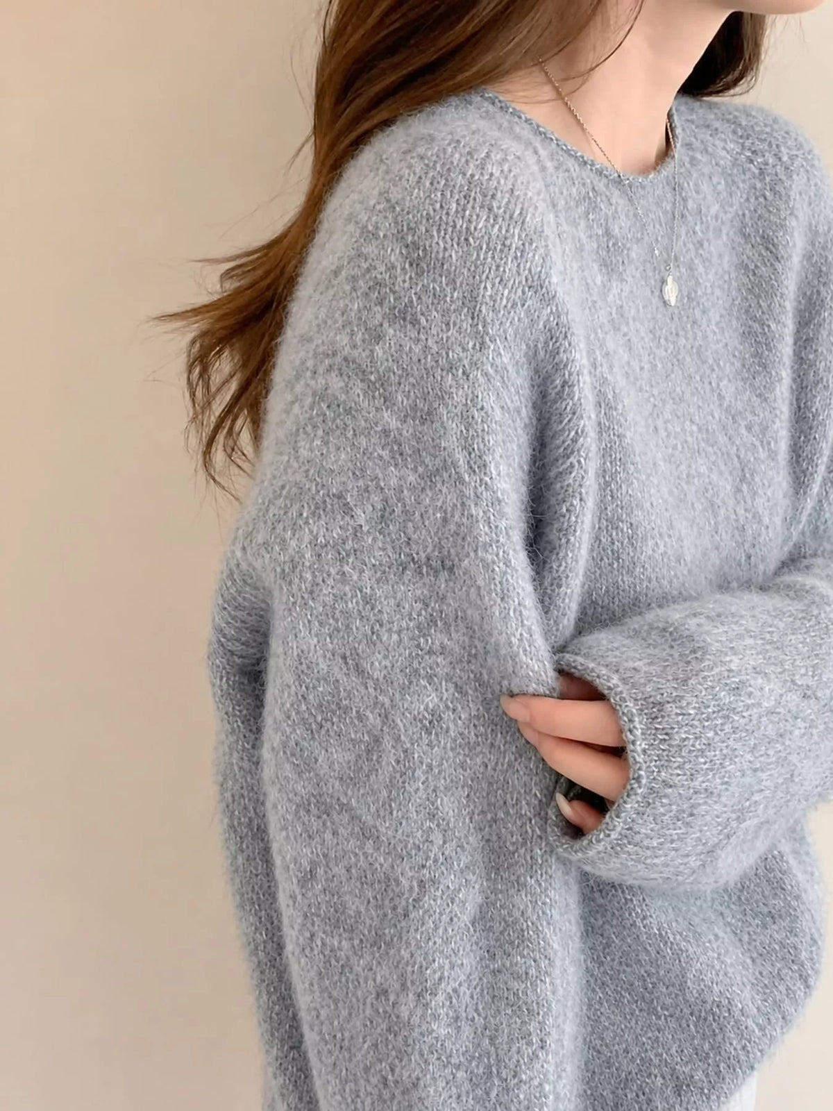 Round neck long sleeve sweater, side view