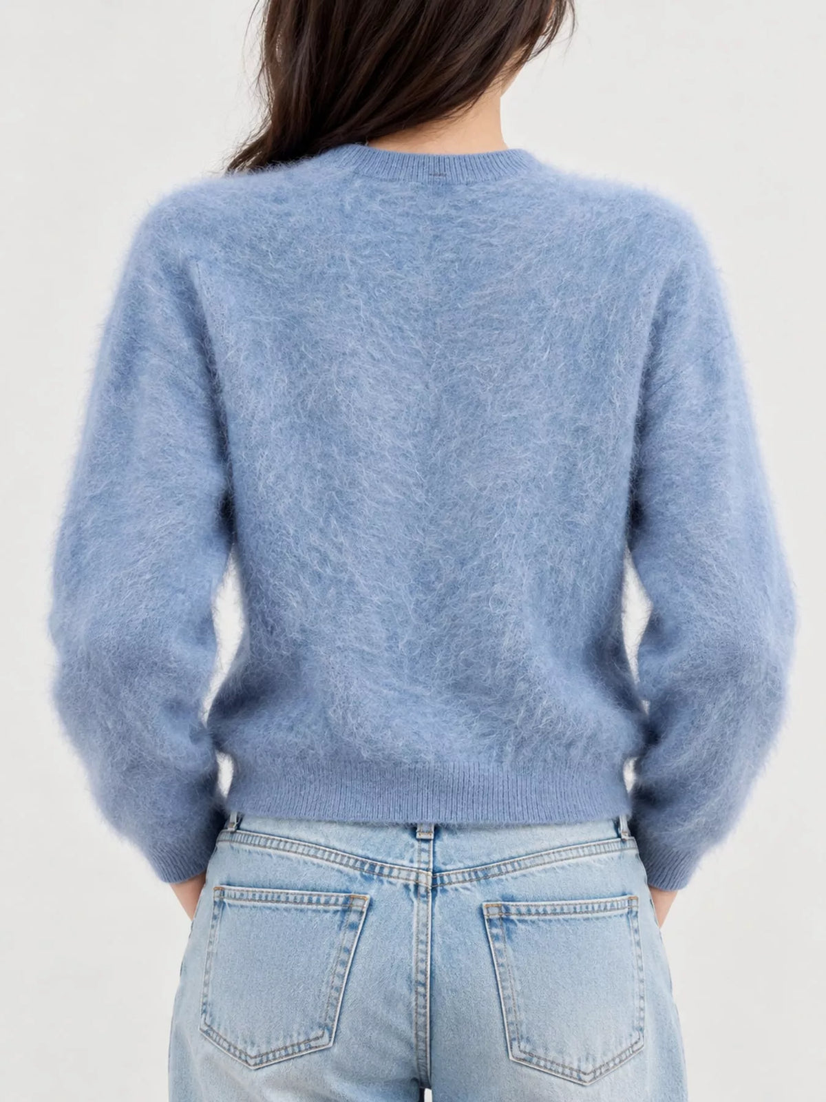 Blue fuzzy button up cropped cardigan, back view