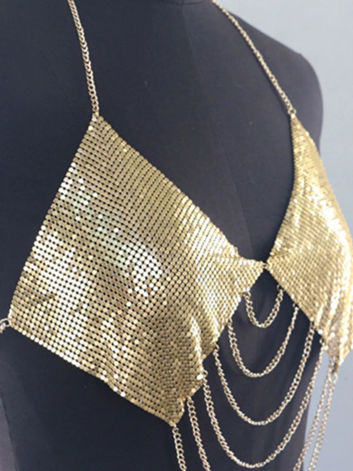 Gold metallic chainmail halter cami top, metal mesh bust panels and draped chains, angled view