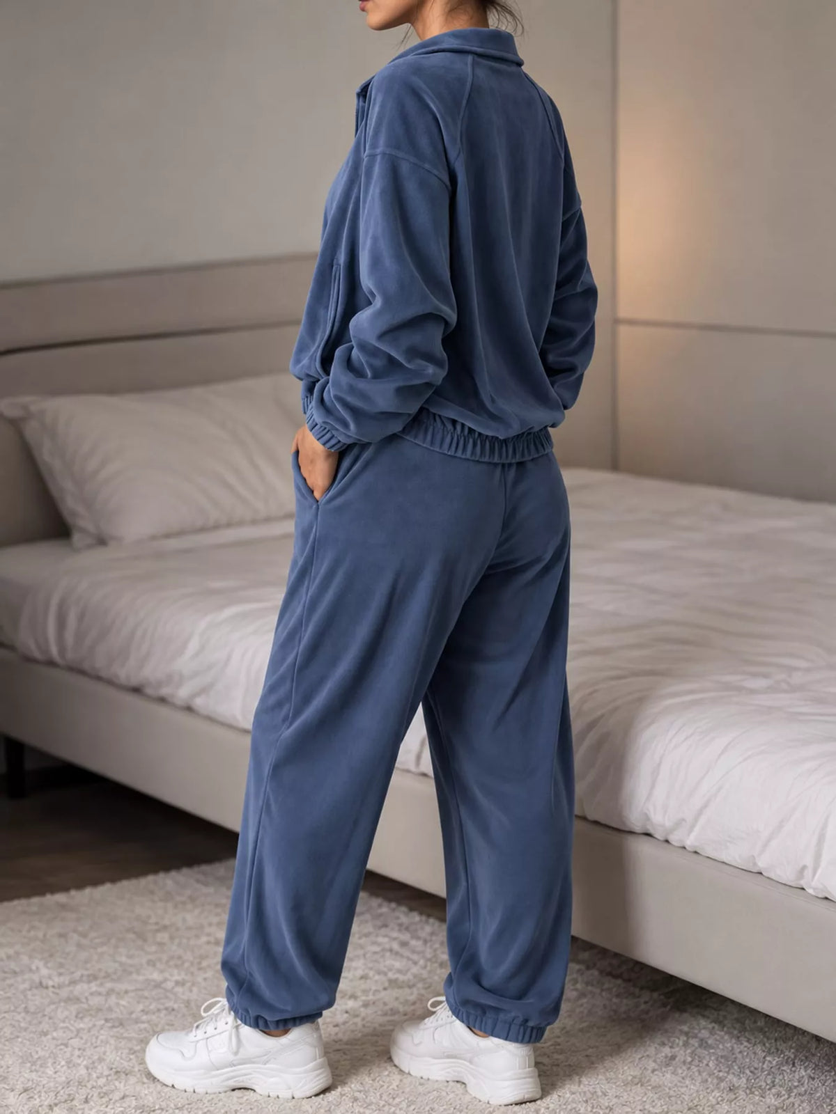 Blue zip-up outerwear and pants set — back view