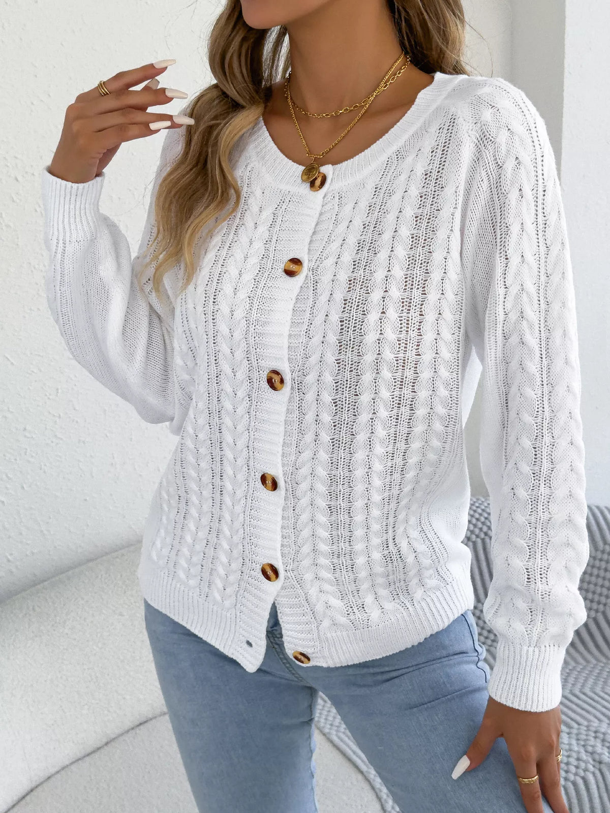 White cable knit button-front cardigan