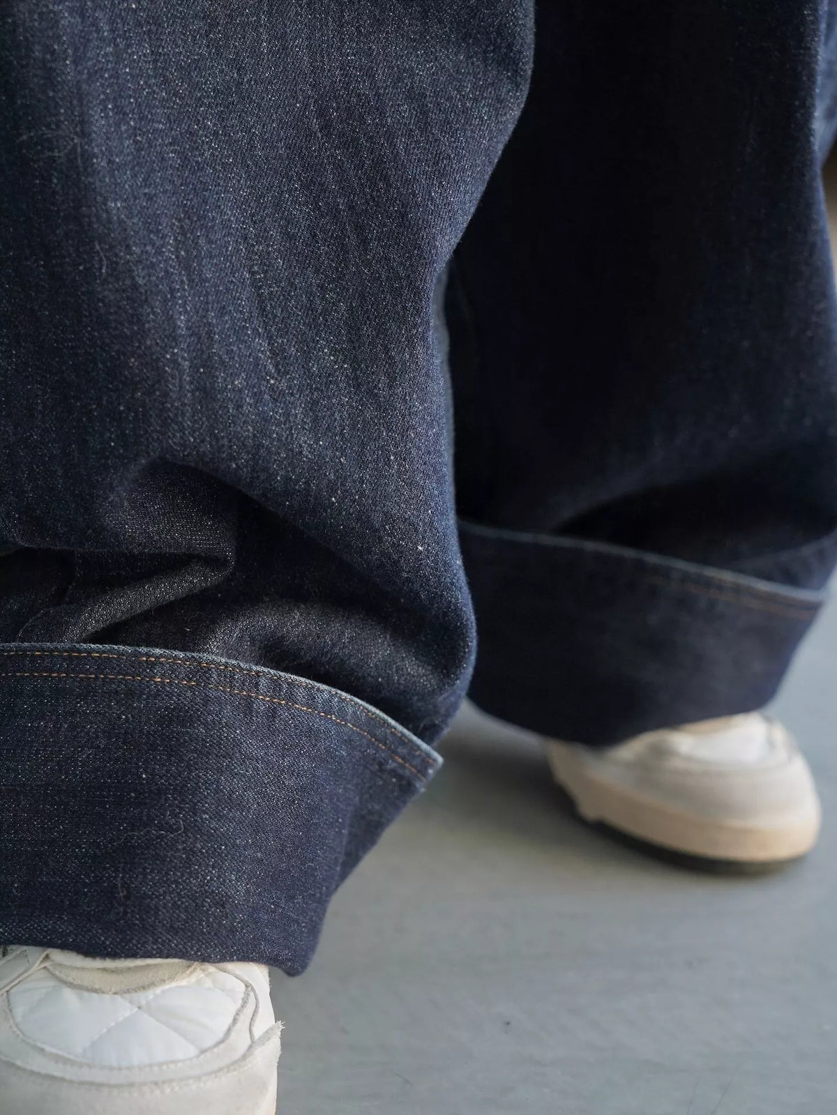 Women's Vintage Dark Wash Wide-Leg Denim Overalls in dark blue — hem detail view