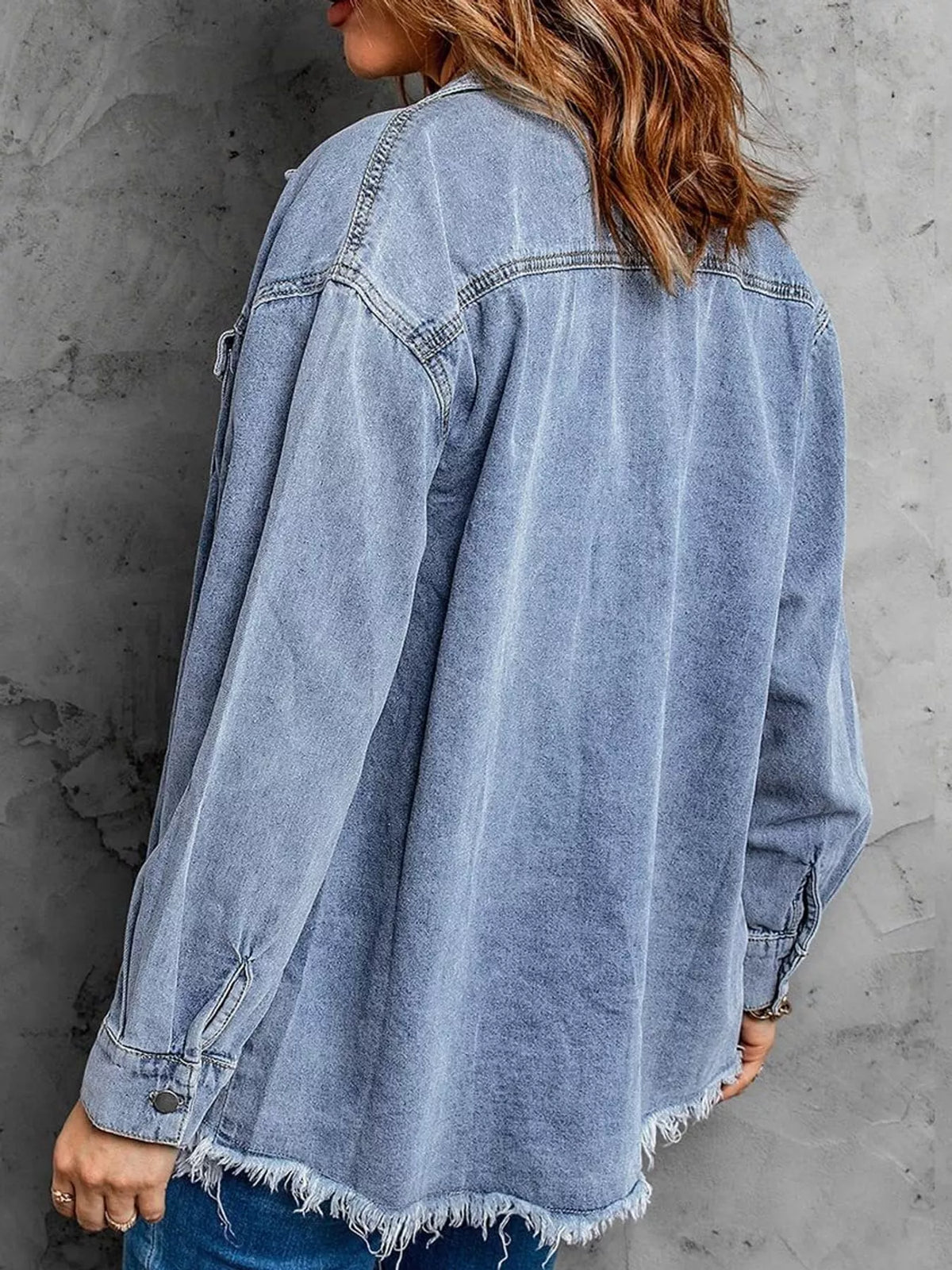 Blue raw hem button-up denim jacket — back view
