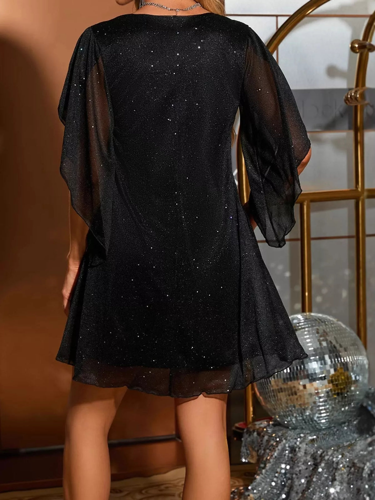 Black glittering v-neck flutter sleeve dress, back view