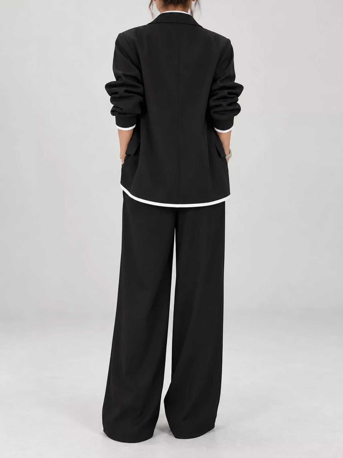 Black contrast-trim blazer and wide-leg pants set, back view