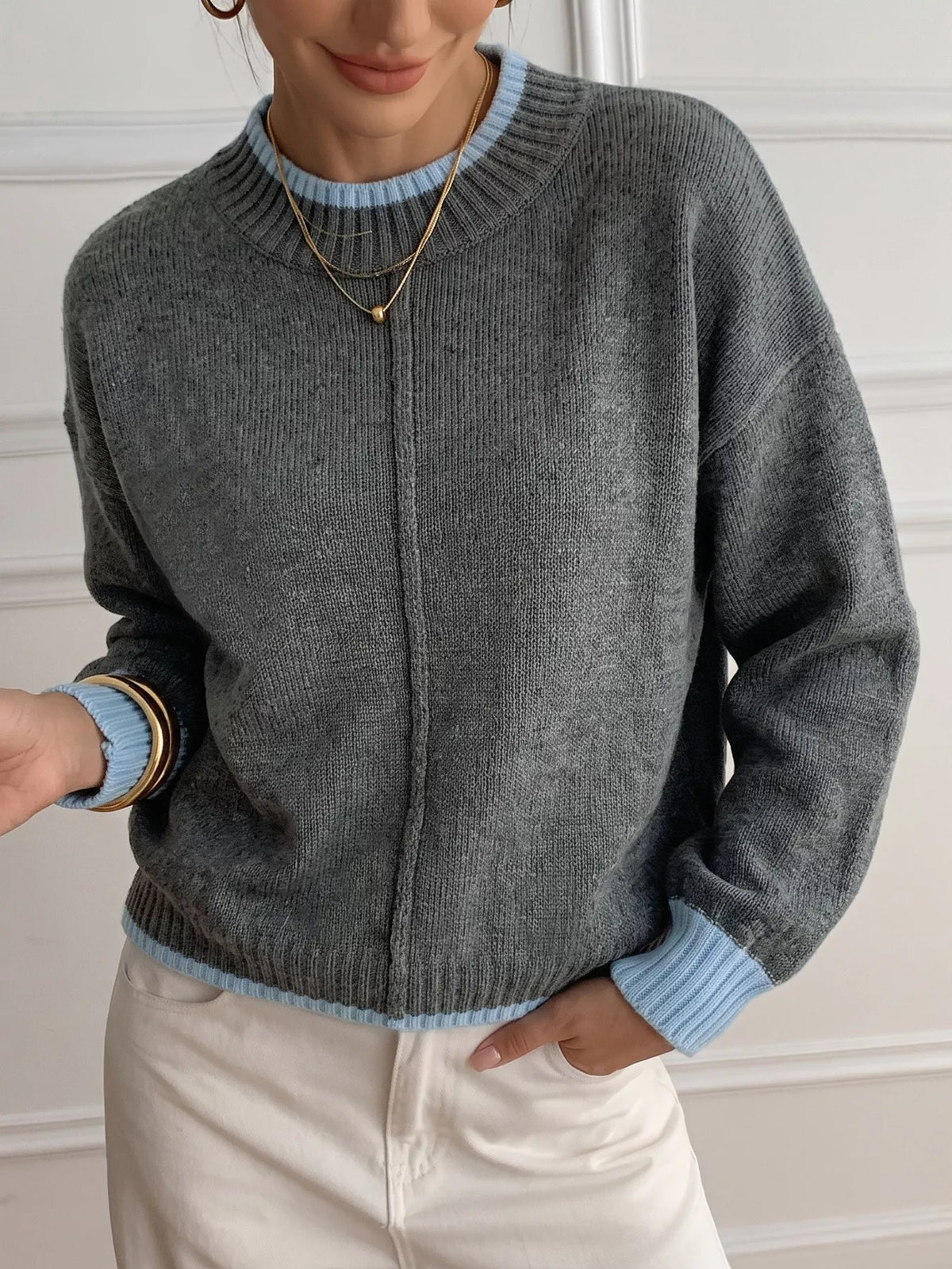 Gray sweater with blue contrast trim, front view