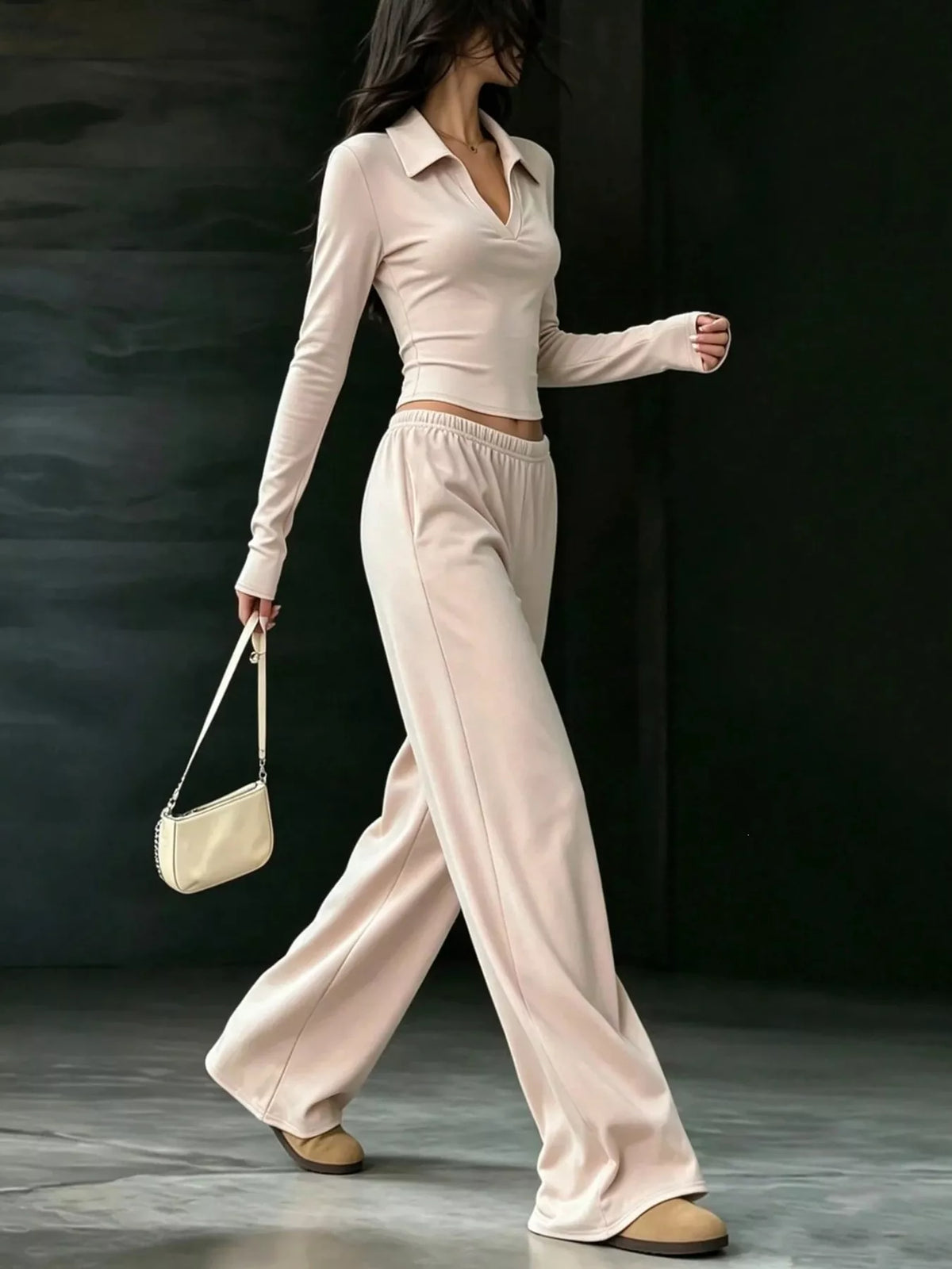 Beige collared crop top and wide-leg pants set, side walking view