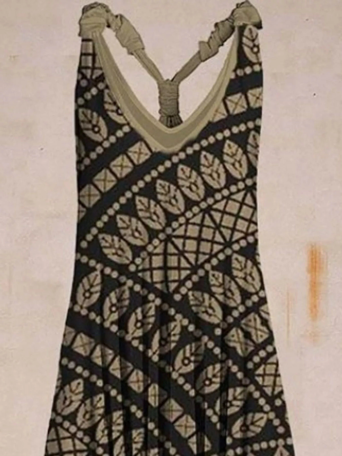 Black geometric-print V-neck sleeveless jumpsuit, neckline and strap detail
