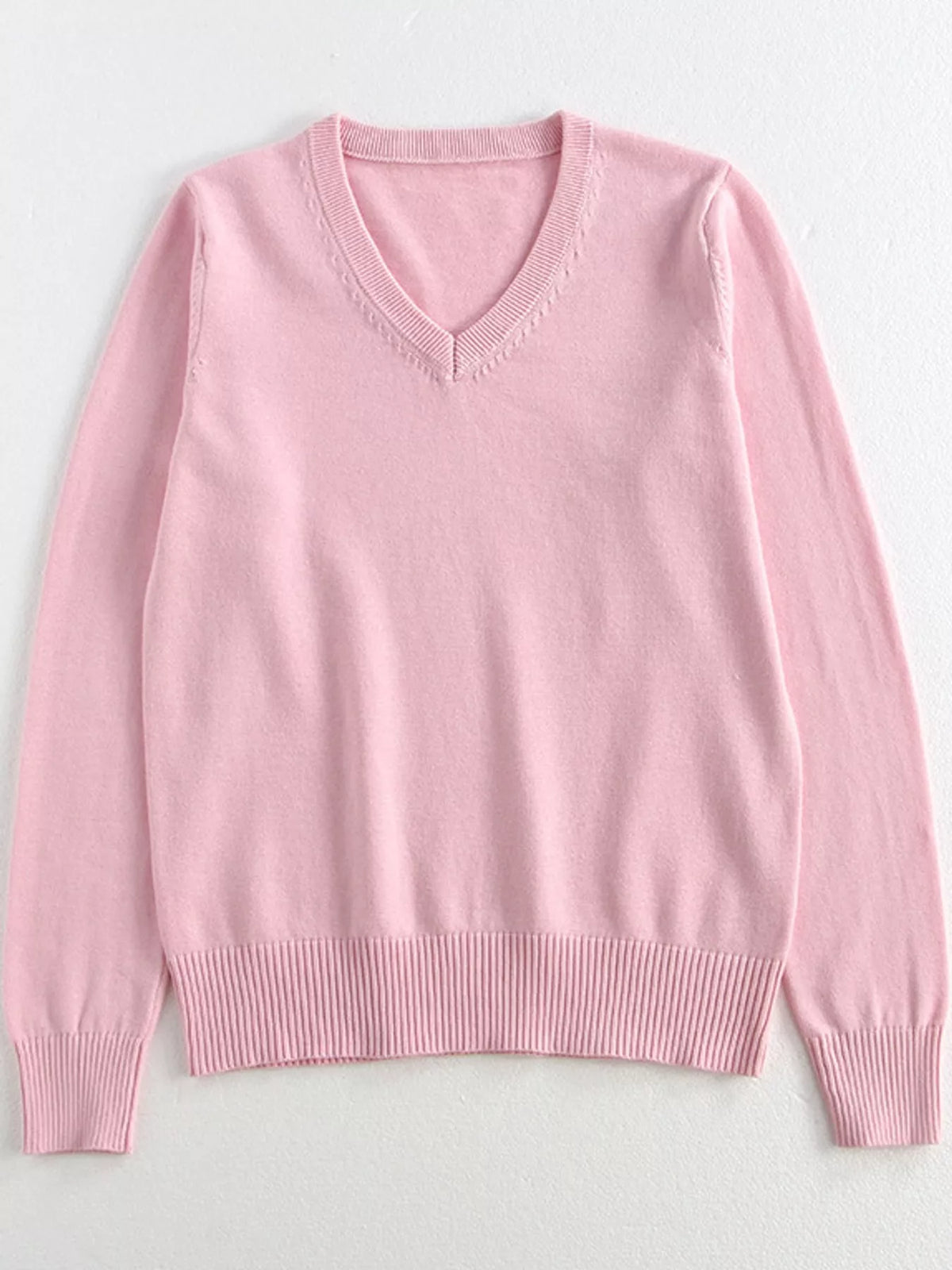 Women's V-Neck Long Sleeve Sweater in pink — flat lay view