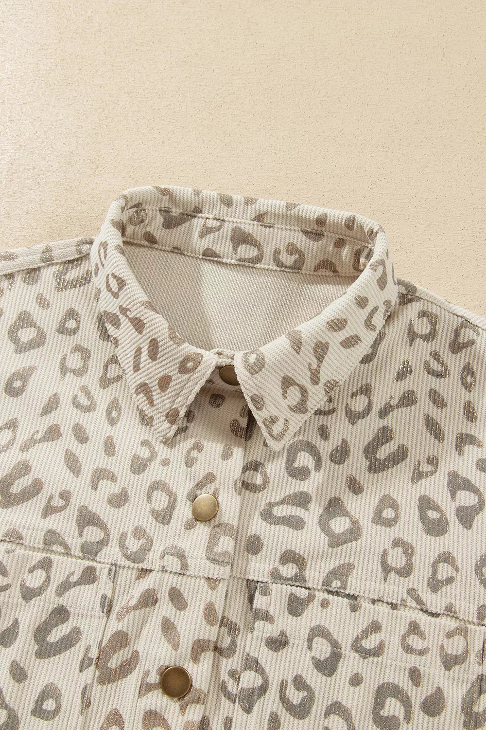 Beige leopard corduroy button-front jacket, collar close-up.